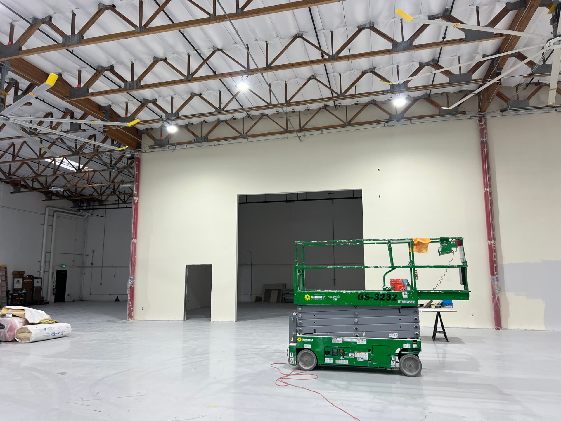 Completed interior warehouse build-out with new demising wall, coated floor and high-bay lighting